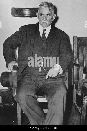 Jafsie Testifies. Black and white photograph of Dr. John Francis Condon, a 72 year-old semi-retired educator and resident of the Bronx, testifying during the Lindbergh murder trial. On March 1, 1932, Charles Augustus Lindbergh Jr., the 20-month-old son of aviators Charles Lindbergh and Anne Morrow Lindbergh, was abducted. On May 12, the child's corpse was discovered by a truck driver. In September 1934, a German immigrant carpenter named Bruno Richard Hauptmann was arrested for the crime. After a trial that lasted from January 2 to February 13, 1935, he was found guilty of first-degree murder Stock Photo