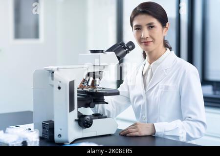 Portrait of Chinese female researcher in laboratory Stock Photo