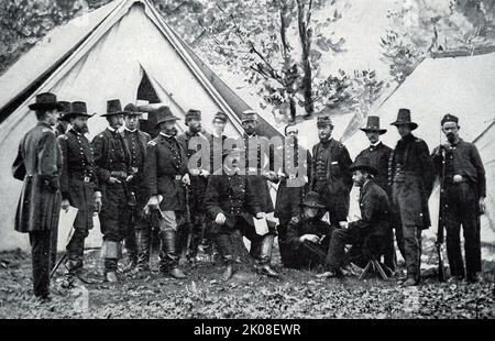 General A. E. Burnside and staff during the American Civil War. Ambrose Everett Burnside (May 23, 1824 - September 13, 1881) was an American army officer and politician who became a senior Union general in the Civil War and three times Governor of Rhode Island, as well as being a successful inventor and industrialist Stock Photo