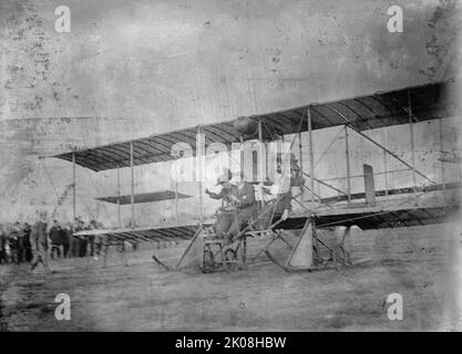Anthony Jannus - Flights And Tests of Rex Smith Plane Flown By Jannus; Miss Laura Merriam In Plane with Jannus, 1912. Early passenger flight, USA. American aviation pioneer Tony Jannus (1889-1916) in a Rex Smith airplane. This flight was one of several made by Jannus with female passengers over Potomac Park, Washington DC. Jannus made the first ever scheduled airline flight. He died in a crash over the Black Sea during World War I. Stock Photo
