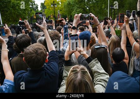 London UK 10th September 2022 - Crowds line and take photographs on their phones in The Mall in London outside St James's Palace where Charles III was formally proclaimed as king today at 11am : Credit Simon Dack / Alamy Live News Stock Photo