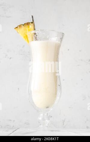Chi Chi Organico cocktail garnished with pineapple wedge Stock Photo