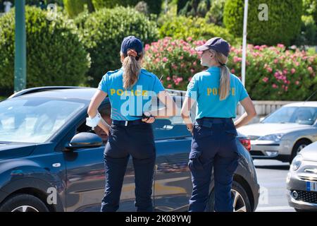 Couple of pretty young police women in Athens Stock Photo