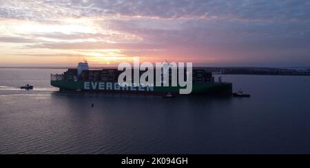 Evergreen Ever Alp arriving at Felixstowe Port, Suffolk at dusk . Stock Photo