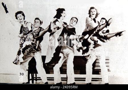 Betty Garrett, Frank Sinatra, Ann Miller, Jules Munshin, Vera Ellen and Gene Kelly in On The Town. On the Town is a 1949 Technicolor musical film with music by Leonard Bernstein and Roger Edens and book and lyrics by Betty Comden and Adolph Green. Betty Garrett (May 23, 1919 - February 12, 2011) was an American actress, comedian, singer and dancer. Francis Albert Sinatra (December 12, 1915 - May 14, 1998) was an American singer and actor who is generally perceived as one of the greatest musical artists of the 20th century. Ann Miller (born Johnnie Lucille Collier; April 12, 1923 - January 22, Stock Photo