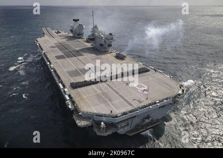 At Sea, UK. 09th Sep, 2022. Royal Navy's flagship HMS Queen Elizabeth troops participate the Death Gun Salute for Her Majesty The Queen Elizabeth II, at sea in the United Kingdom on Friday, September 9, 2022. the Death Gun Salute was fired at 1300 September 9, in London, around the United Kingdom and at saluting stations at home and abroad. Photo by UK MOD/ Credit: UPI/Alamy Live News Stock Photo