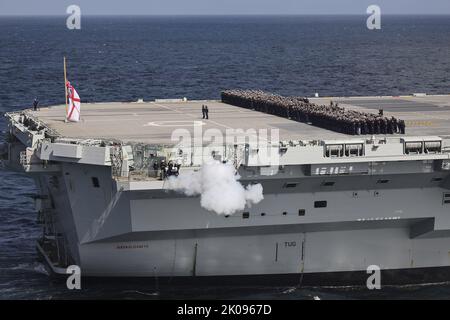 At Sea, UK. 09th Sep, 2022. Royal Navy's flagship HMS Queen Elizabeth troops participate the Death Gun Salute for Her Majesty The Queen Elizabeth II, at sea in the United Kingdom on Friday, September 9, 2022. the Death Gun Salute was fired at 1300 September 9, in London, around the United Kingdom and at saluting stations at home and abroad. Photo by UK MOD/ Credit: UPI/Alamy Live News Stock Photo