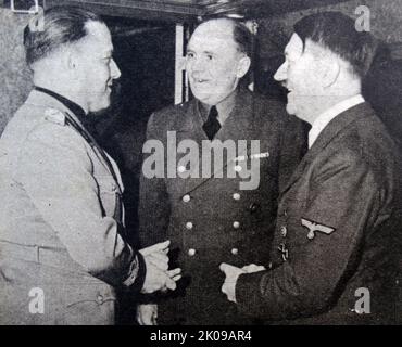 Count Ciano, Adolf Hitler and his interpreter Dr Schmidt, in Vienna. Gian Galeazzo Ciano, 2nd Count of Cortellazzo and Buccari (18 March 1903 - 11 January 1944) was an Italian diplomat and politician who served as Foreign Minister in the government of his father-in-law, Benito Mussolini, from 1936 until 1943. Paul-Otto Schmidt (23 June 1899 - 21 April 1970) was an interpreter in the German foreign ministry from 1923 to 1945. Adolf Hitler (20 April 1889 - 30 April 1945) was an Austrian-born German politician who was the dictator of Germany from 1933 until his death in 1945. He rose to power as Stock Photo