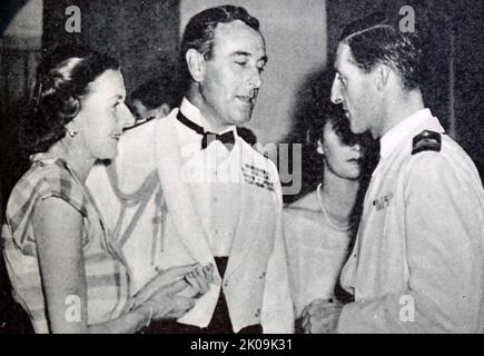 Lord and Lady Mountbatten with Commander John Kerans at the Gala dance in Valetta, Malta. Louis Francis Albert Victor Nicholas Mountbatten, 1st Earl Mountbatten of Burma (born Prince Louis of Battenberg; 25 June 1900 - 27 August 1979), was a member of the British royal family, Royal Navy officer and statesman. During the Second World War, he was Supreme Allied Commander, South East Asia Command. Commander John Simon Kerans DSO (30 June 1915 - 12 September 1985) was an officer in the Royal Navy and later a Conservative Party politician. Stock Photo
