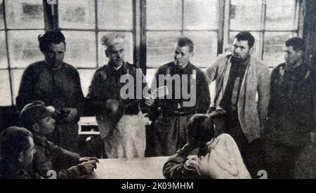 Russian prisoners of the Finns during World War II, with neutral journalists photographing the captives at rest, to avoid Soviet accusations of maltreatment. Stock Photo