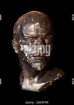 Bronze bust of Vladimir Lenin (1870 - 1924), Russian revolutionary, politician, and political theorist. He served as the first and founding head of government of Soviet Russia from 1917 to 1924 and of the Soviet Union from 1922 to 1924. Stock Photo