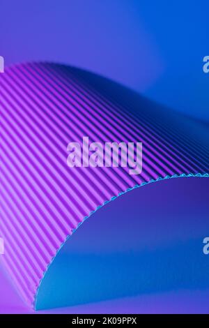 Abstract geometric background with violet and teal hues. Corrugated lines futuristic backdrop. Stock Photo