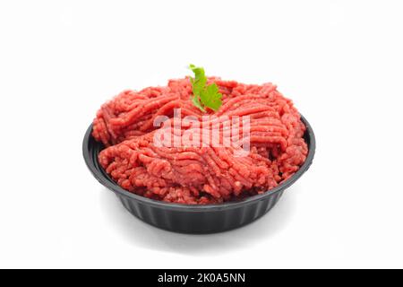 Fresh Raw Minced Beef in Black Bowl Isolated on White Background Stock Photo