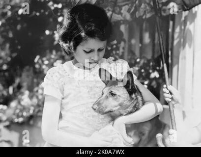 Young Princess Elizabeth (c1938) with her pet corgi, a breed of Welsh herding dogs the future Queen would dearly love throughout her lifetime. (UK) Stock Photo