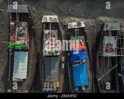 Chittagong, Chattogram, Bangladesh. 10th Sep, 2022. Chittagong, Bangladesh, 10 September 2022 : Fishermen sleeping on fishing boats. They catch fish in the deep sea all night and come to the Chittagong fishing ghat on the river bank and fatigue sleep under the open sky in the boat. Chittagong and Coxbazar is main center of sea fishing in Bangladesh.More than 40,000 families engaged with sea fishing. (Credit Image: © Muhammad Amdad Hossain/ZUMA Press Wire) Stock Photo