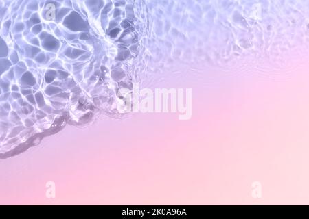 Serum or water texture close up. Bright violet and pink gradient liquid gel background. Transparent beauty skincare sample. Water clear transparent Stock Photo