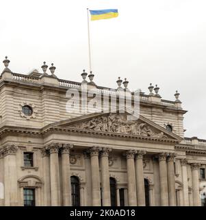 Ukrainian flag outside the British Treasury building, London, 3rd March 2022, during the first days of the Russian invasion of Ukraine. Russia began an invasion of Ukraine on 24 February 2022, in an escalation of the Russo-Ukrainian War that began in 2014. It is the largest conventional military attack in Europe since World War II Stock Photo