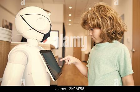 child interact with robot artificial intelligence, communication Stock Photo