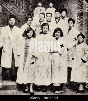 Students from medical schools in Shanghai take part in medical work at the hospital for wounded soldiers. This was during the Japanese invasion of China. Stock Photo