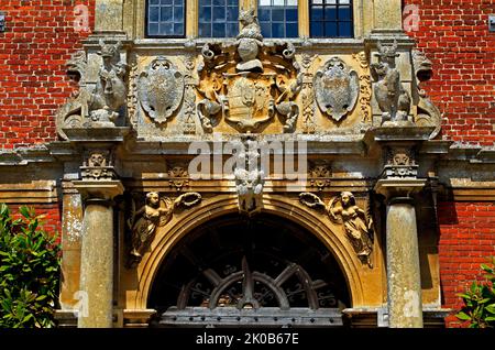 Blickling Hall, Jacobean, Norfolk, detail of heraldry, above entrance, England, UK Stock Photo