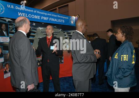 HUD Displays, Staff at Job Fair - HUD representatives, displays, promotions for Presidential Management Fellows (PMF) Program at Job Fair, Washington, D.C. Convention Center. HUD Displays, Staff at Job Fair Subject, HUD representatives, displays, promotions for Presidential Management Fellows (PMF) Program at Job Fair, Washington, D.C. Convention Center. Stock Photo