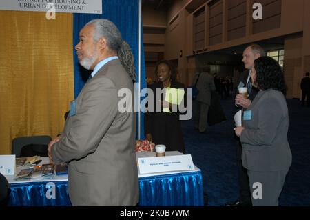 HUD Displays, Staff at Job Fair - HUD representatives, displays, promotions for Presidential Management Fellows (PMF) Program at Job Fair, Washington, D.C. Convention Center. HUD Displays, Staff at Job Fair Subject, HUD representatives, displays, promotions for Presidential Management Fellows (PMF) Program at Job Fair, Washington, D.C. Convention Center. Stock Photo