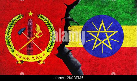 Ethiopia vs TPLF flags on a wall with a crack. Tigray People’s Liberation Front (TPLF) and Ethiopia conflict, war crisis, relationship concept Stock Photo