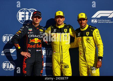 Monza, Italy. 10th Sep, 2022. Ferrari's Monegasque driver Charles Leclerc (C), Red Bull Racing's Dutch driver Max Verstappen (L) and Ferrari's Spanish driver Carlos Sainz pose for photos after the qualifying session of the Formula 1 Italian Grand Prix at Monza Circuit, Italy, Sept. 10, 2022. Credit: Qian Jun/Xinhua/Alamy Live News Stock Photo