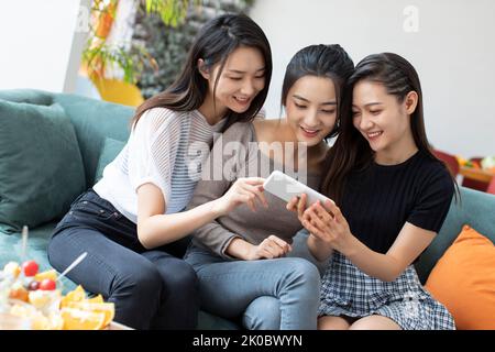 Happy Chinese friends having fun together Stock Photo