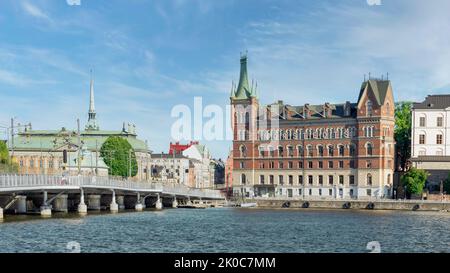 View from City Hall overlooking Riddarholmshamnen Island, with Centralbron bridge, mediating Norstedt Building, or Norstedtshuset, and House of Nobility, or Riddarhuset, Stockholm, Sweden Stock Photo