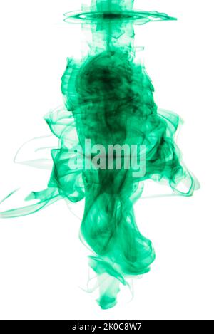Ink-credibe. Studio shot of green ink in water against a white background. Stock Photo