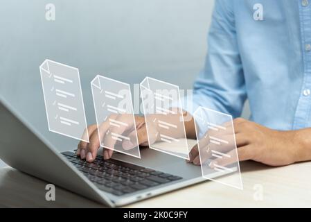 Business productivity checklist and filling survey form online. Online documentation database and document management system.Businessman using compute Stock Photo