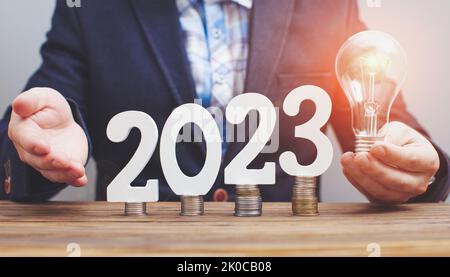 Human hand holding light bulb to illuminate, idea of creativity and inspiration concept of sustainable business development. Stock Photo
