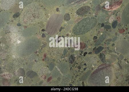 Twister Green natural granite stone texture, photo of slab. Soft matt Italian stone texture for interior, exterior home decoration, floor tiles and Stock Photo