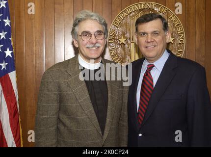 Secretary Mel Martinez with Reverend Luis Leon. Secretary Mel Martinez with Reverend Luis Leon Subject, Secretary Mel Martinez receiving visit at HUD Headquarters from Reverend Luis Leon, Rector of St. John's Episcopal Church, Washington, D.C. Stock Photo