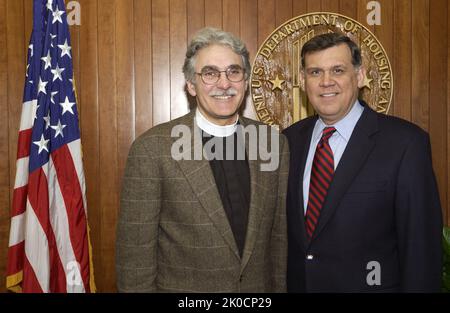 Secretary Mel Martinez with Reverend Luis Leon. Secretary Mel Martinez with Reverend Luis Leon Subject, Secretary Mel Martinez receiving visit at HUD Headquarters from Reverend Luis Leon, Rector of St. John's Episcopal Church, Washington, D.C. Stock Photo