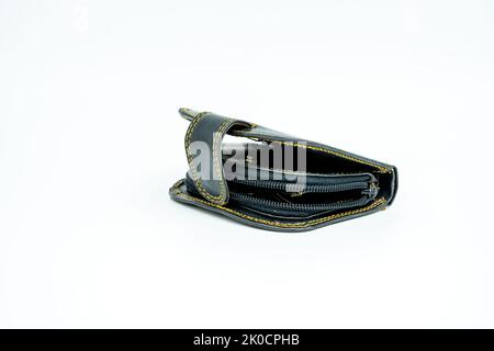 Black leather clip-on wallet with yellow thread on a white background Stock Photo