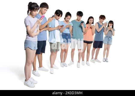 Chinese college students using smart phones Stock Photo