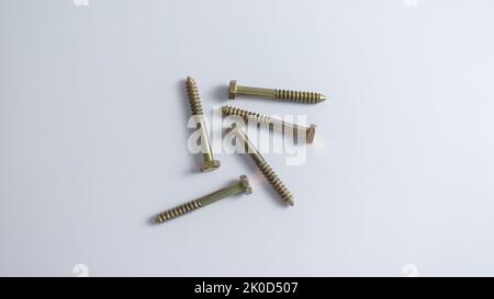 Industrial screw bolt on a white isolated background with selective focus Stock Photo