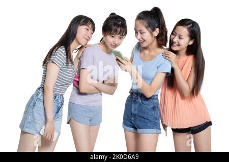 Cheerful Chinese college students using smart phone Stock Photo