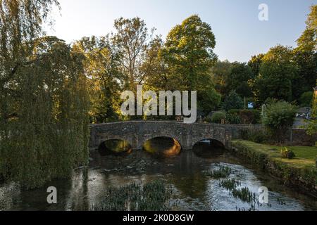 A stone bridge over the River Coln in Bibury, United Kingdom Stock Photo