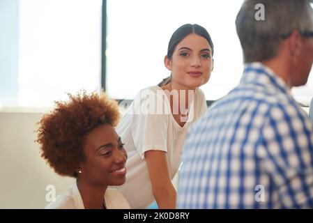 Where others see stumbling blocks leaders see stepping-stones. colleagues working in an office. Stock Photo