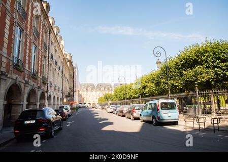Paris, France. August 2022. The arcades on the Place des Vosges, Marais district, Paris. High quality photo Stock Photo