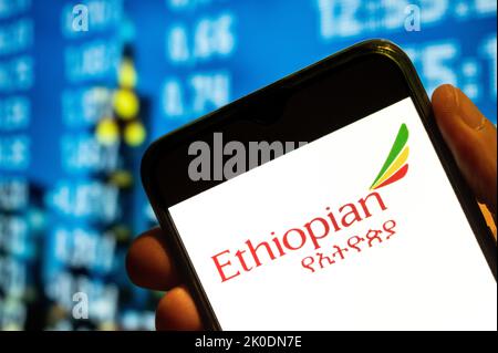 In this photo illustration, the national airline of Ethiopia Ethiopian Airlines logo is displayed on a smartphone screen. Stock Photo