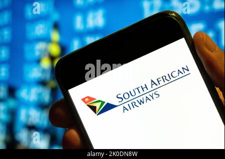 In this photo illustration, the South African Airways airline logo is displayed on a smartphone screen. Stock Photo