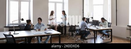 Modern office space with diverse working busy employees Stock Photo