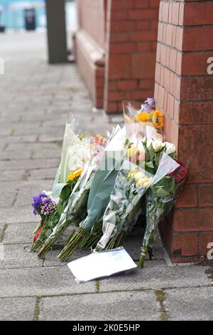 Cardiff, Wales, UK. 11th Sep, 2022. Floral tributes left outside The Pierhead Building, Cardiff Bay, Wales, 11th September 2022.Credit Penallta Photographics/Alamy Live Credit: Penallta Photographics/Alamy Live News Stock Photo