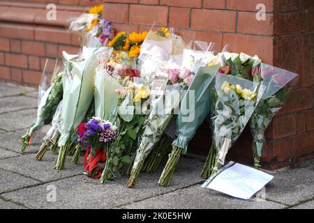 Cardiff, Wales, UK. 11th Sep, 2022. Floral tributes left outside The Pierhead Building, Cardiff Bay, Wales, 11th September 2022.Credit Penallta Photographics/Alamy Live Credit: Penallta Photographics/Alamy Live News Stock Photo
