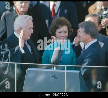 The inauguration of Jimmy Carter as the 39th president of the United States was held on Thursday, January 20, 1977, at the East Portico of the United States Capitol in Washington D.C. Chief Justice Warren E. Burger administered the presidential oath of office to Carter. Stock Photo