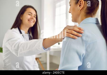 Happy patient Caucasian woman receives professional support and advice from female doctor Stock Photo